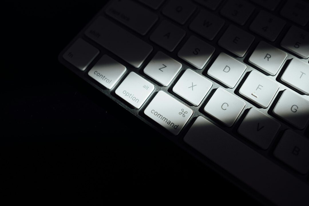 Hands typing on a laptop in low light for a secure message