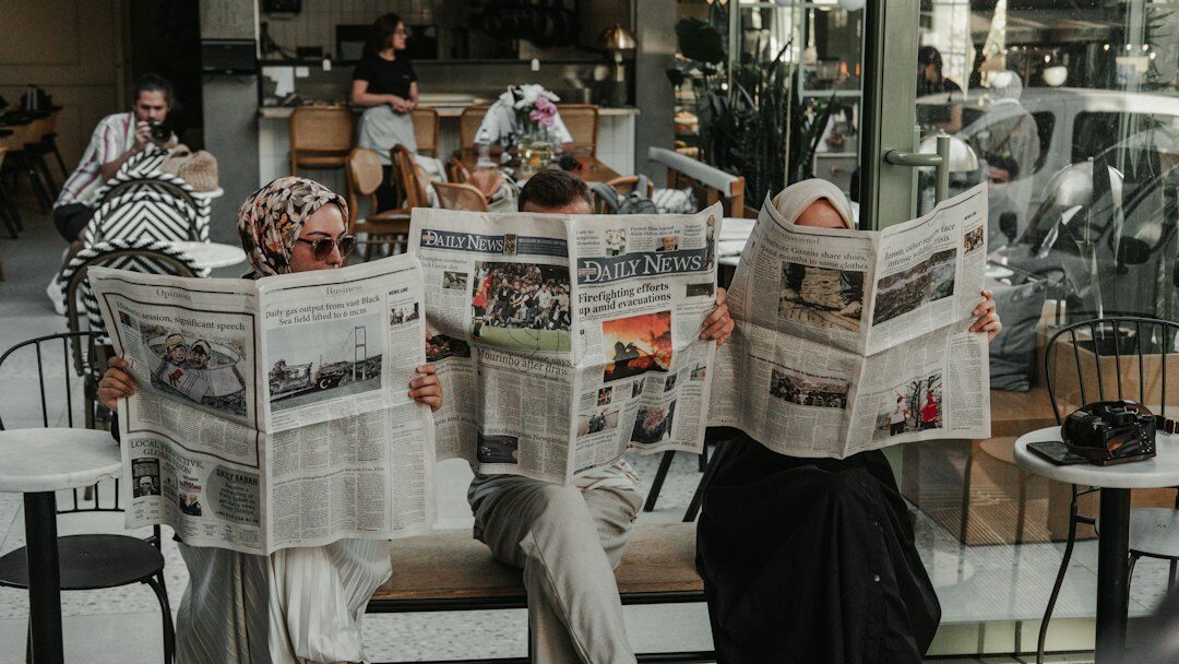 person reading newspaper