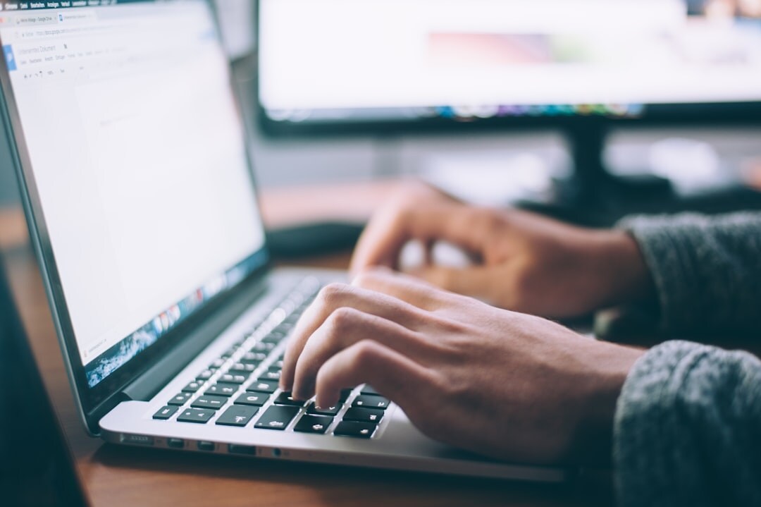 person fact checking on computer